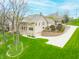 Stately brick home with a large lawn, mature trees, and multi-level layout at 2733 Foxborough Dr, Greenwood, IN 46143