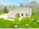 Inviting home featuring mature trees, manicured lawn, and professional landscaping at 2733 Foxborough Dr, Greenwood, IN 46143