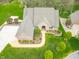 Beautiful home featuring manicured lawn, mature trees, and a charming walkway at 2733 Foxborough Dr, Greenwood, IN 46143