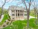 Multi-level home showcasing balconies, garage, landscaping, and charming brick exterior at 2733 Foxborough Dr, Greenwood, IN 46143