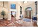 Spacious foyer features hardwood floors, high ceilings, an art display, and a doorway to the office at 2733 Foxborough Dr, Greenwood, IN 46143