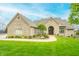 Charming home with a lush lawn, an arched entryway, and well-maintained landscaping that enhances curb appeal at 2733 Foxborough Dr, Greenwood, IN 46143