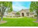Charming home featuring a lush lawn, an arched entryway, and well-maintained landscaping that enhances curb appeal at 2733 Foxborough Dr, Greenwood, IN 46143