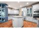 Spacious kitchen features granite counters, stainless appliances, hardwood floors, and a functional center island at 2733 Foxborough Dr, Greenwood, IN 46143