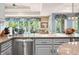 Kitchen sink with stainless steel appliances and a window overlooking the dining area at 2733 Foxborough Dr, Greenwood, IN 46143