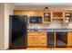 Traditional kitchen with wood cabinets, granite countertops, modern appliances, and a wine rack at 2733 Foxborough Dr, Greenwood, IN 46143