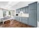 Spacious laundry room with extensive cabinetry, a functional sink, and a bright window seat area for added convenience at 2733 Foxborough Dr, Greenwood, IN 46143