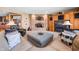 Cozy living room featuring a brick fireplace, plush seating, and warm, inviting ambiance at 2733 Foxborough Dr, Greenwood, IN 46143