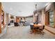 Spacious living room with fireplace, dining area, and view of outdoor foliage at 2733 Foxborough Dr, Greenwood, IN 46143