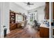 Bright home office with custom wood built-ins, hardwood floors, and a view of the outdoors at 2733 Foxborough Dr, Greenwood, IN 46143