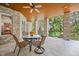 Inviting covered patio with brick pillars, wood ceiling, and comfortable seating at 2733 Foxborough Dr, Greenwood, IN 46143