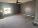 Bare room with a window and grey carpeted floors at 3008 N Michigan Rd, Shelbyville, IN 46176