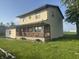 This two-story home boasts a covered porch and traditional siding, set in a serene, grassy setting at 3008 N Michigan Rd, Shelbyville, IN 46176