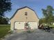 Detached two-car garage with a gable roof and a gravel driveway provides ample parking and storage at 3008 N Michigan Rd, Shelbyville, IN 46176