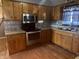 Well-equipped kitchen with stainless steel appliances, granite countertops, and wooden cabinets at 3008 N Michigan Rd, Shelbyville, IN 46176