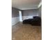 A spacious living room featuring plush carpeting and comfortable seating area at 3008 N Michigan Rd, Shelbyville, IN 46176