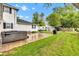 Backyard featuring an exterior view of the house, a hot tub, and a shed with a well-maintained lawn at 301 S B St, Thorntown, IN 46071