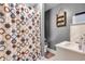 Full bathroom featuring shower with modern circular shower curtain at 301 S B St, Thorntown, IN 46071