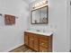 Bright bathroom with a wood vanity and plenty of storage at 301 S B St, Thorntown, IN 46071