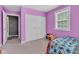 Bedroom featuring carpet, a double bed, a window, and a closet with white doors at 301 S B St, Thorntown, IN 46071
