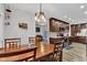 A well-lit dining area with seating for four and a view of the open floor plan at 301 S B St, Thorntown, IN 46071