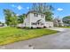 A lovely two-story home boasting a spacious yard, a front porch, and an attached two-car garage at 301 S B St, Thorntown, IN 46071