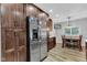 The well-lit kitchen features stainless steel appliances and wood cabinets at 301 S B St, Thorntown, IN 46071