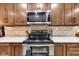 An updated kitchen is equipped with stainless steel appliances and stylish hardware at 301 S B St, Thorntown, IN 46071