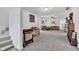 Spacious living room featuring plush carpeting and ample space for relaxation and entertainment at 301 S B St, Thorntown, IN 46071