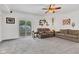 Comfortable living room with neutral-toned sofas and a sliding glass door to the backyard at 301 S B St, Thorntown, IN 46071