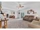 Spacious living area offering lots of room for seating, along with a ceiling fan at 301 S B St, Thorntown, IN 46071
