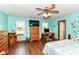 Bright bedroom featuring hardwood floors, ample light, and ceiling fan at 3027 Ash Way, Lapel, IN 46051