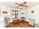 Bedroom featuring a ceiling fan, window, and keyboard at 3027 Ash Way, Lapel, IN 46051