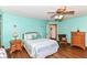 This bedroom has hardwood floors, ceiling fan and a charming paint color at 3027 Ash Way, Lapel, IN 46051