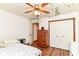 Bedroom featuring wood floors, a double closet, and bright white walls at 3027 Ash Way, Lapel, IN 46051