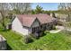 Well-maintained home featuring a lush green lawn, mature trees, and charming front porch at 3027 Ash Way, Lapel, IN 46051