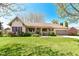 Charming ranch-style home with a well-maintained lawn, inviting porch, and attached two-car garage at 3027 Ash Way, Lapel, IN 46051