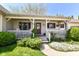 Charming front porch with white railings, decorative plants, and inviting seating at 3027 Ash Way, Lapel, IN 46051