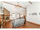 Inviting living room features a brick fireplace, wood beams, and hardwood floors at 3027 Ash Way, Lapel, IN 46051