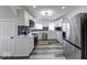 Well-equipped kitchen featuring stainless steel appliances, marble countertops, and modern backsplash at 3132 Indianapolis Ave, Indianapolis, IN 46208