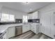 Bright kitchen showcasing stainless steel appliances, white cabinetry, and modern design at 3132 Indianapolis Ave, Indianapolis, IN 46208