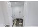 Bright laundry room featuring new flooring and all-white paint at 3132 Indianapolis Ave, Indianapolis, IN 46208
