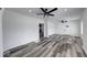 Bright and open living room with fireplace views, modern ceiling fans, and stylish floors at 3132 Indianapolis Ave, Indianapolis, IN 46208