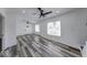 Bright and airy living room featuring modern ceiling fans, stylish floors, and large windows at 3132 Indianapolis Ave, Indianapolis, IN 46208
