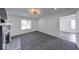 Spacious living room with freshly painted walls and new carpet at 3132 Indianapolis Ave, Indianapolis, IN 46208