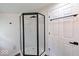 Bathroom featuring a modern glass-enclosed shower stall, new flooring, and a white door at 3132 Indianapolis Ave, Indianapolis, IN 46208