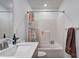 Well-lit bathroom showcasing bathtub-shower combo and a double vanity at 3148 Hawking Ct, Danville, IN 46122