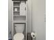 Small bathroom featuring a toilet with a sliding barn door cabinet and paper holder at 3148 Hawking Ct, Danville, IN 46122