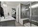 Contemporary bathroom with double vanity, walk-in shower, and elegant tile work at 3148 Hawking Ct, Danville, IN 46122