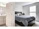 Comfortable bedroom showcases a king-sized bed and natural light from a window, offering a serene retreat at 3148 Hawking Ct, Danville, IN 46122